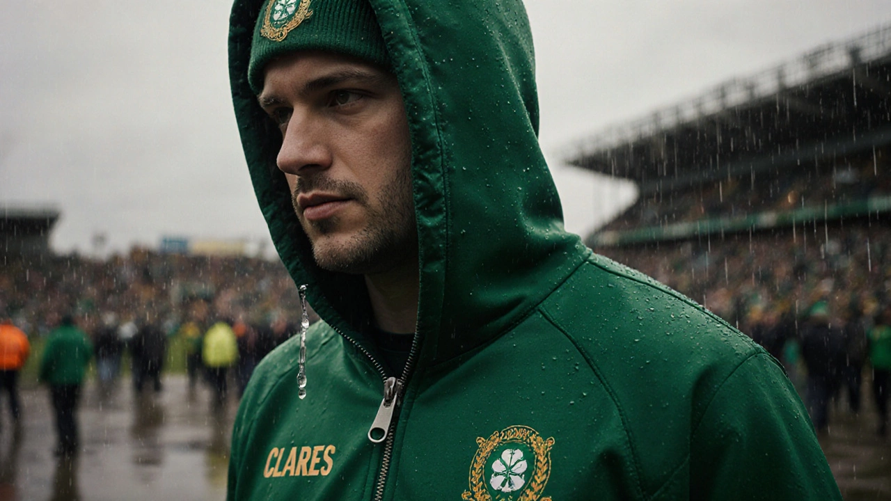 GAA fan wearing a team-colored zip-up hoodie at Croke Park in the rain.